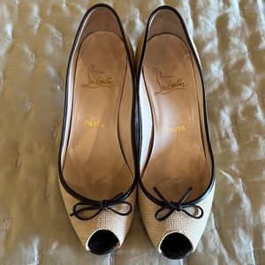 Elegant woven 3 inch heel Louboutin shoe with open toe.
